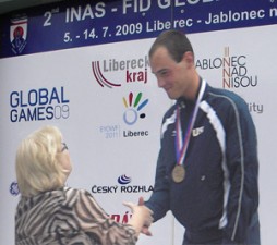 Cyclist Syd Lea accepting one of his 5 Global Games medals.